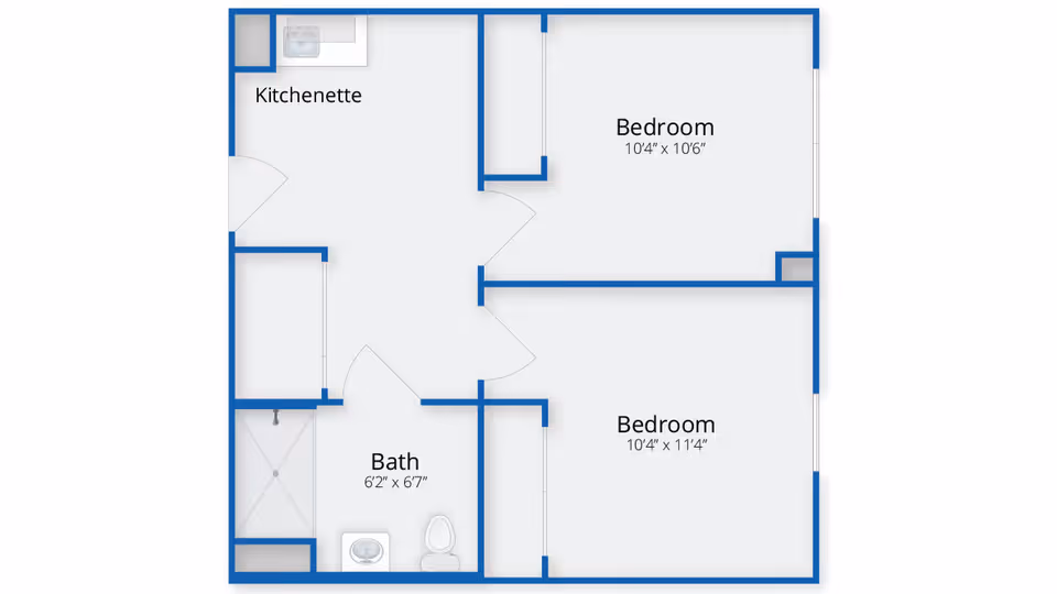 Floor plan layout showing two bedrooms, a bath, and a kitchenette. The bedrooms are labeled with dimensions 10'4" x 10'6" and 10'4" x 11'4". The bath measures 6'2" x 6'7" and includes a shower, sink, and toilet. The kitchenette is adjacent to the bath.