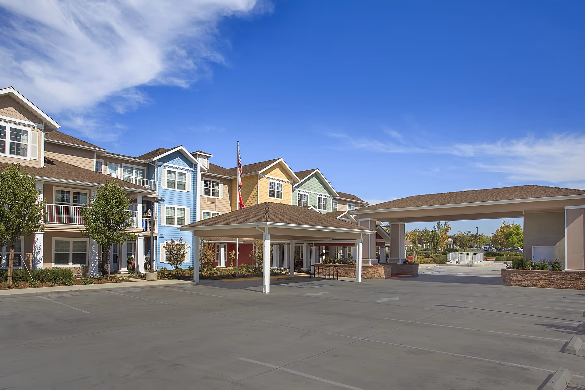 Exterior view of Holiday Chateau at Harveston showing colorful building and covered entrance.