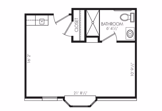 Architectural floor plan of a studio apartment layout showing a combined living and kitchen area, a closet, and a bathroom with a shower, toilet, and sink. Dimensions are marked for each section.