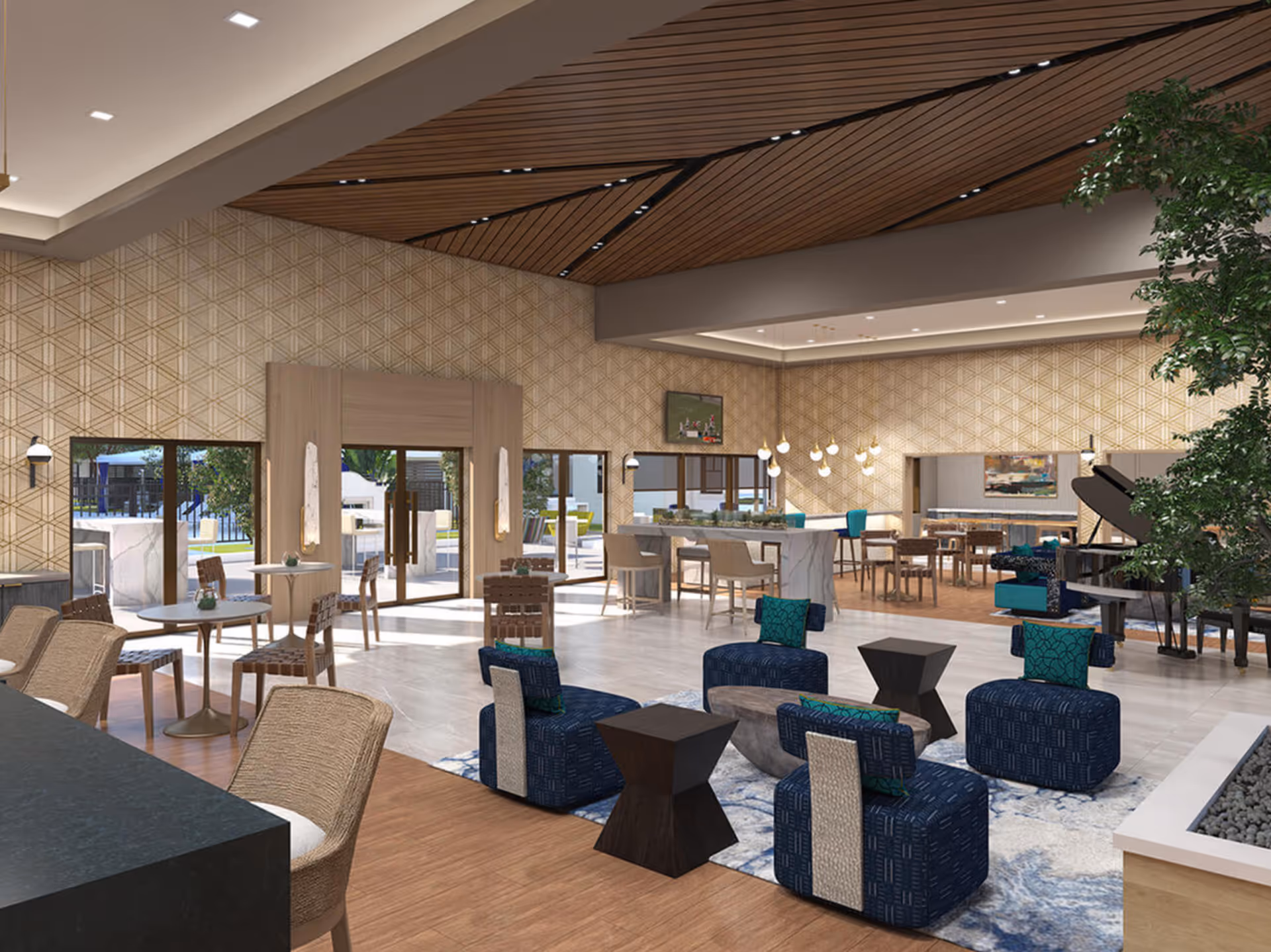 Spacious and modern common area with a mix of seating options including blue cushioned chairs with green pillows, wooden chairs around small round tables, and bar stools at a marble counter. The room features a decorative wooden ceiling, patterned beige walls, large windows and glass doors leading outside, and a grand piano near a large indoor plant.