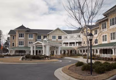 Exterior view of Sunrise of Cary building with circular driveway and entrance canopy.