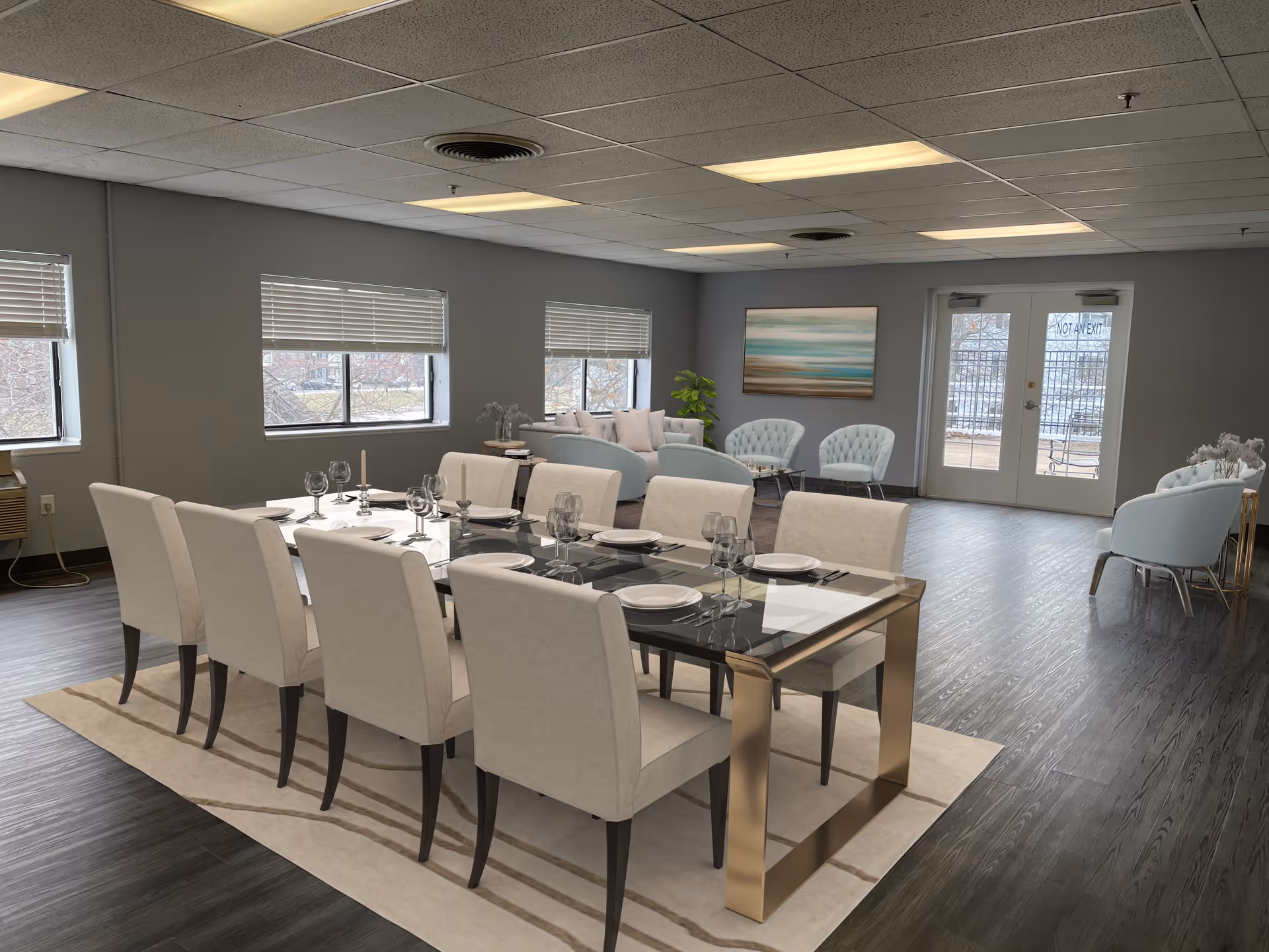 A spacious and modern dining and lounge area in an assisted living facility. The dining area features a long glass table with gold legs, surrounded by eight beige upholstered chairs, set with plates, glasses, and candles. The lounge area has light blue cushioned chairs and sofas arranged around small tables, with a large abstract painting on the wall and double glass doors leading outside.