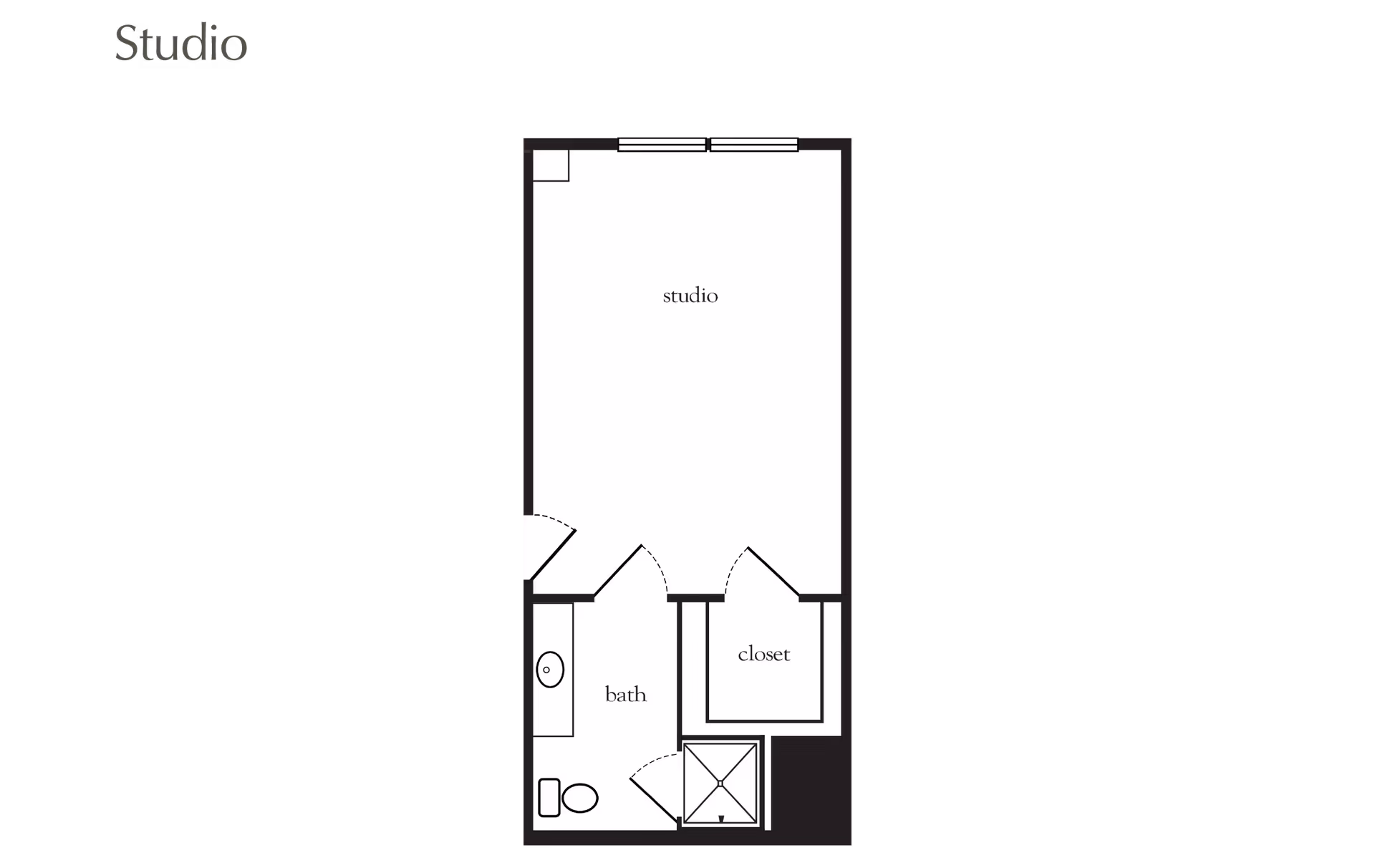 Floor plan of a studio apartment showing a main studio area, a bathroom with a toilet and sink, and a closet.