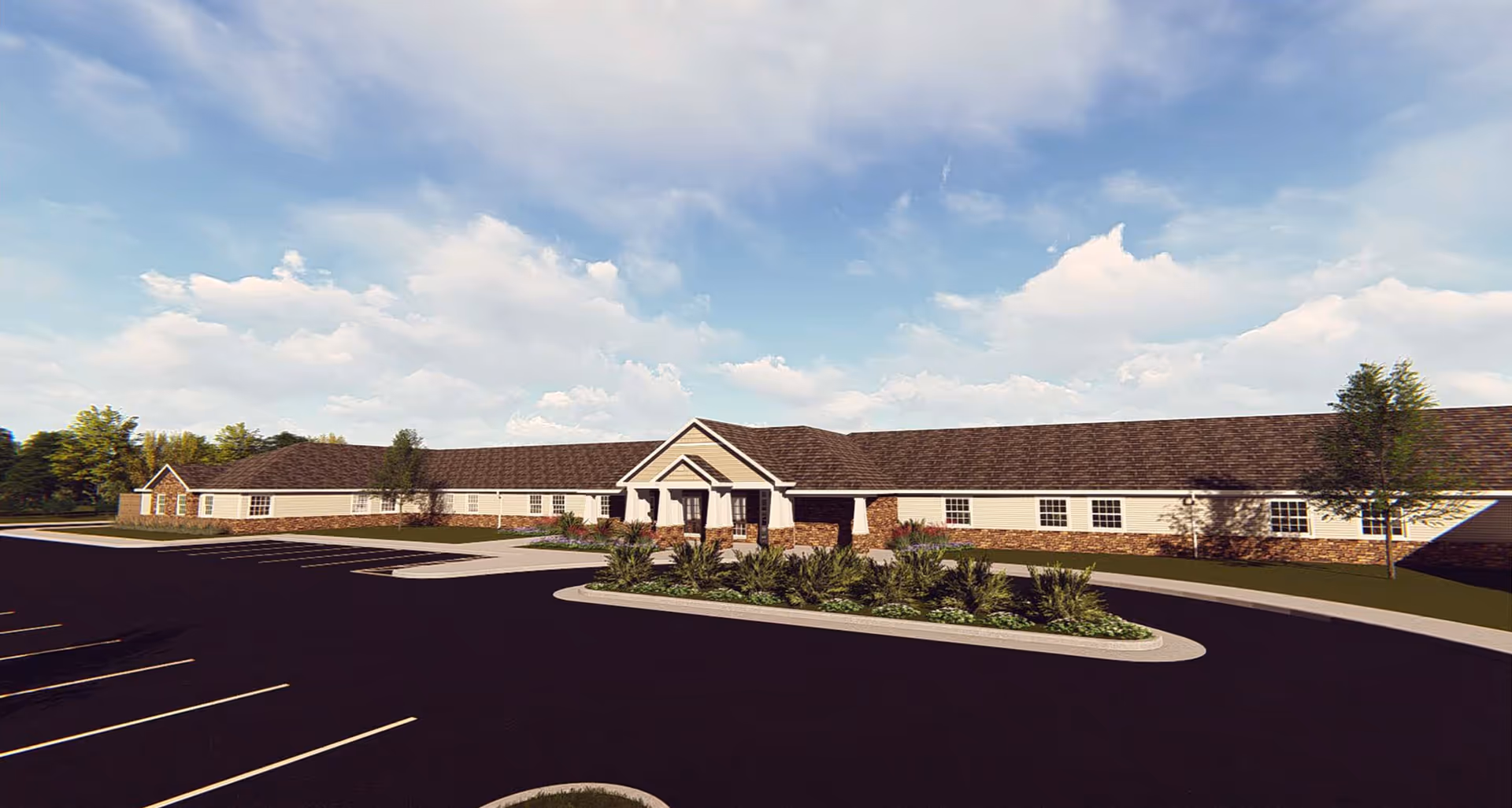 Exterior view of a single-story senior living facility building with a large parking lot in front, landscaped greenery, and a partly cloudy sky.
