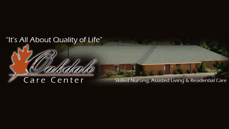 Exterior view of Oakdale Care Center, a single-story brick building with a green roof, surrounded by greenery and a driveway. The image includes the text 'It's All About Quality of Life' and 'Skilled Nursing, Assisted Living & Residential Care' along with the Oakdale Care Center logo featuring a maple leaf.