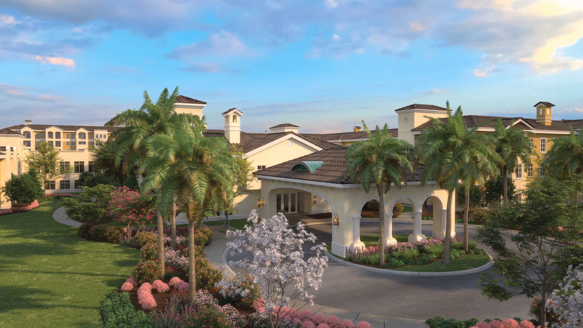 Exterior view of Legacy Pointe at UCF senior living facility featuring a large entrance with arches, palm trees, landscaped gardens with colorful flowers, and a clear blue sky with some clouds.