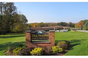 Front view of Ellen Memorial Health Care Center sign on a well kept lawn.