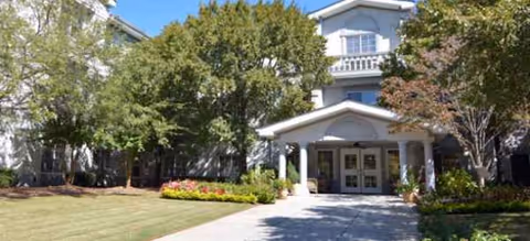Pearl at Sandy Springs exterior entrance with columns and landscaped grounds.