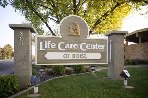 Entrance sign reading Life Care Center of Boise with stone pillars and greenery