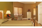 A cozy bedroom in a senior living facility with a bed covered in a green bedspread, a bedside table with a lamp and flowers, a patterned armchair, a window with wooden blinds, an air conditioning unit below the window, and a white dresser with a vase of flowers on top.