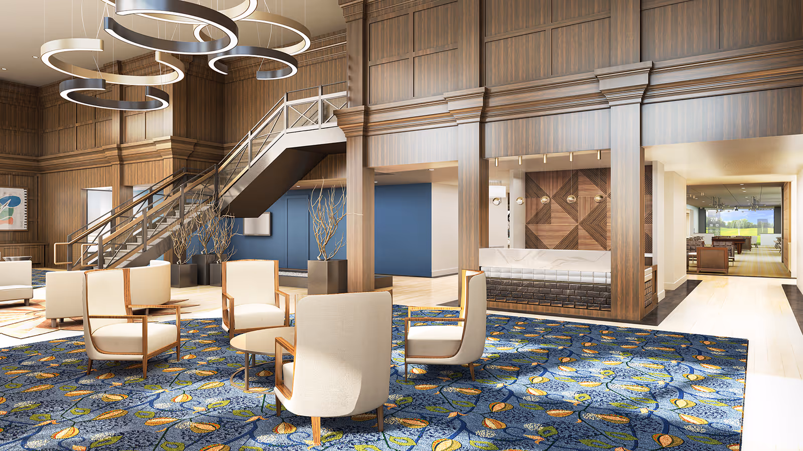 A spacious and elegant common area with modern circular ceiling lights, wooden panel walls, a staircase with metal railings, and comfortable beige armchairs arranged around a round table on a blue patterned carpet. The area includes decorative plants and leads to other rooms with wooden flooring.