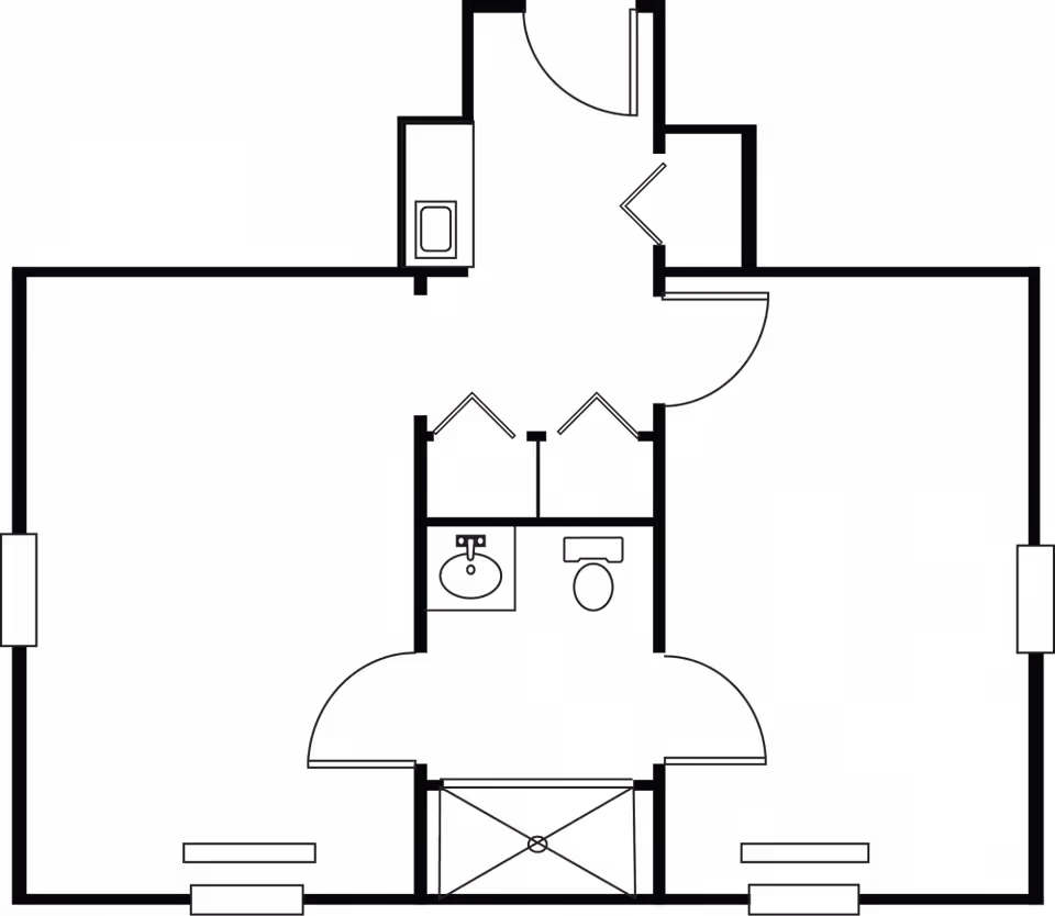 Black floor-plan drawing of a small apartment showing a central bathroom with a sink and toilet, surrounding rooms, and multiple doors.