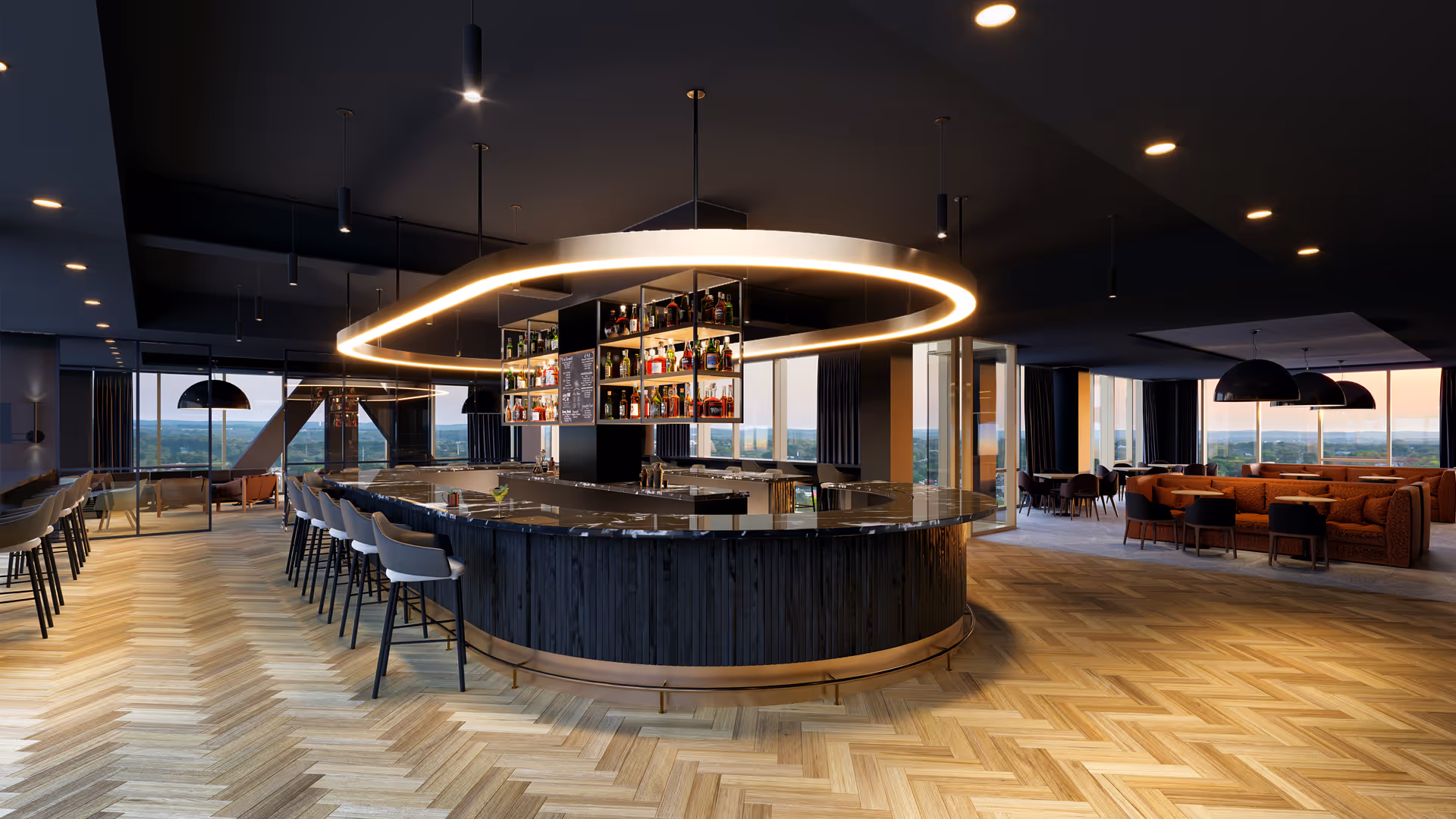 Modern interior space featuring a large curved bar with high stools arranged around it. Above the bar hangs a distinctive oval-shaped light fixture and shelves stocked with bottles. The room has large windows offering panoramic views, wood-patterned herringbone flooring, and seating areas with sofas and tables in the background.