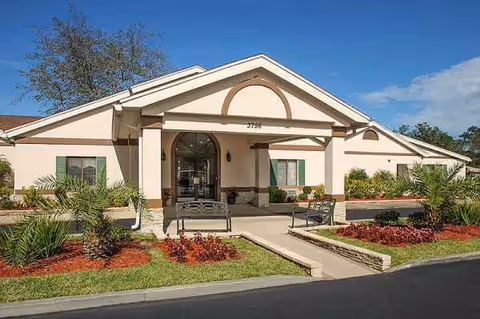 Front exterior of Life Care Center of Hilliard with entrance and landscaped walkway.