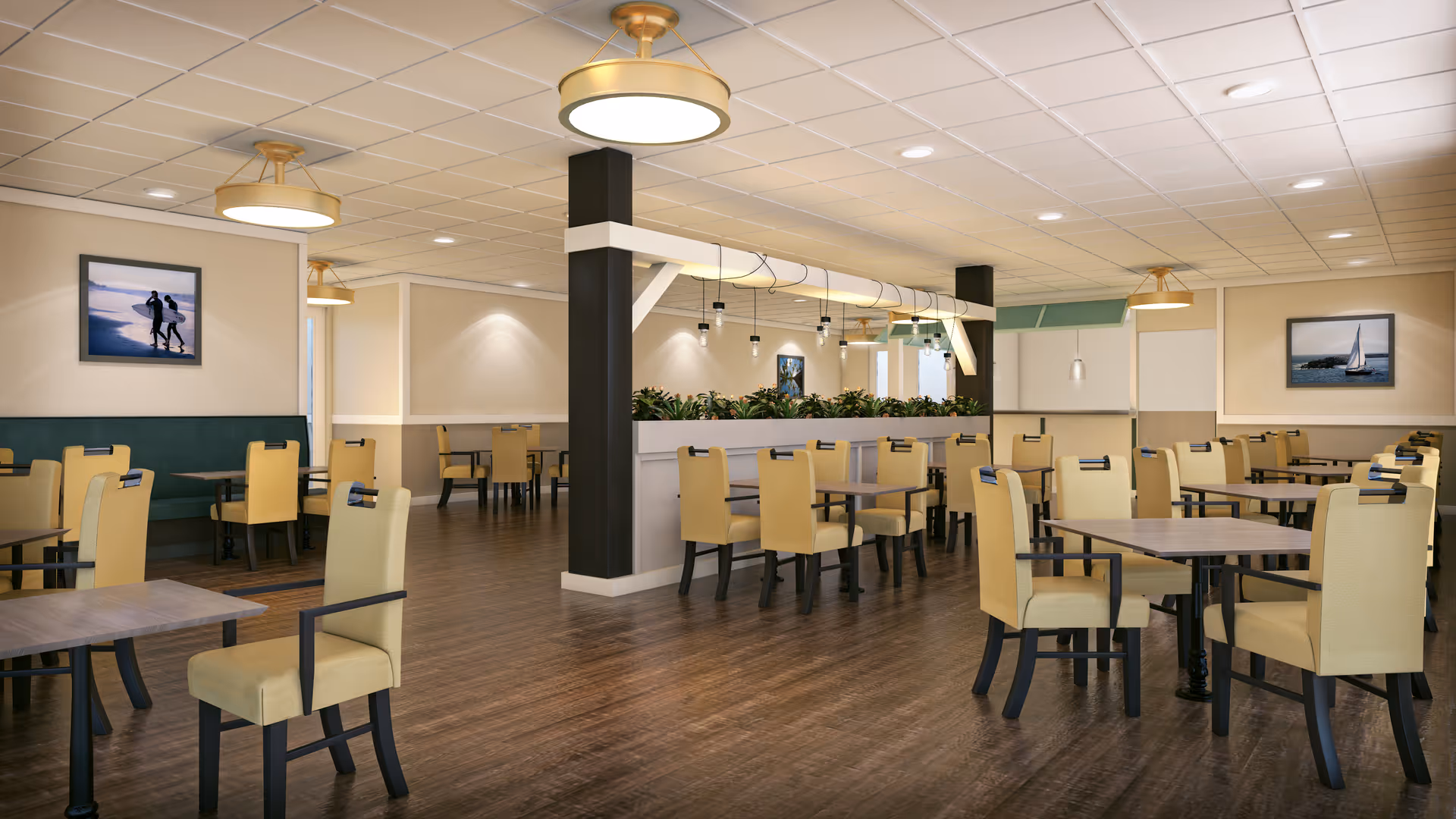 A spacious dining room with multiple tables and yellow upholstered chairs arranged neatly. The room features wooden flooring, beige walls, ceiling lights, and framed pictures on the walls. There is a central divider with plants and hanging lights above it.