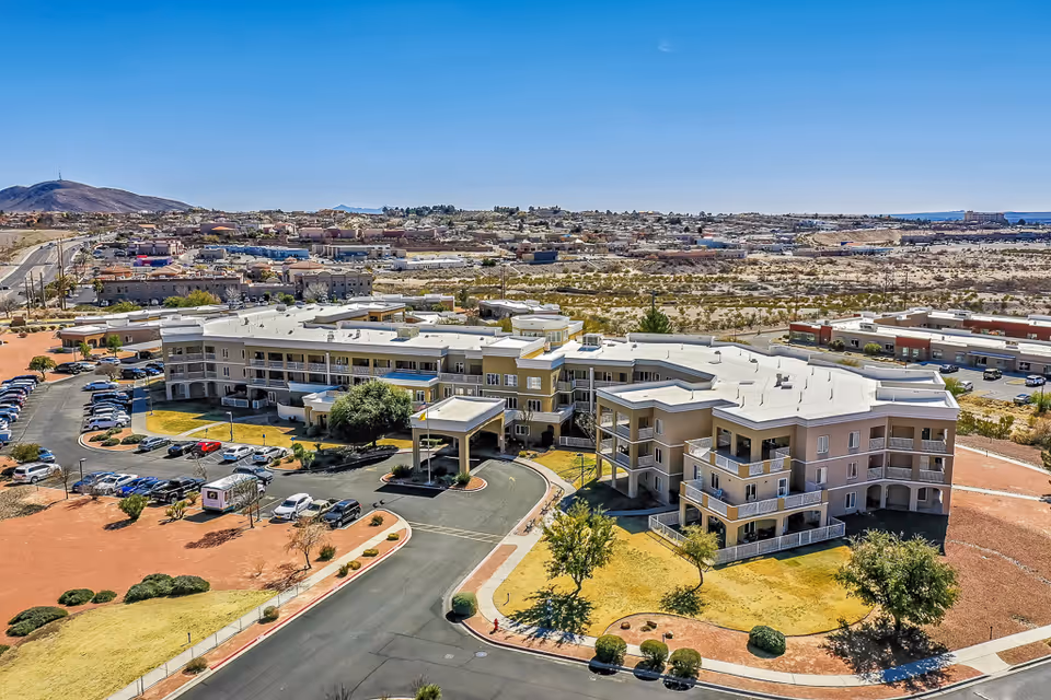 Aerial view of Solstice Senior Living at Las Cruces complex and surrounding desert landscape.