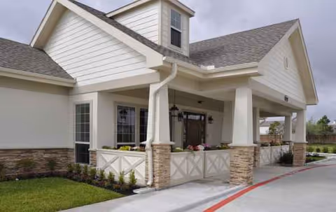 Exterior view of Evergreen Cottages facility with a covered entrance.