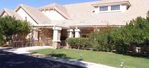 Front view of Brookdale North Tucson building with a covered entrance and manicured landscaping.