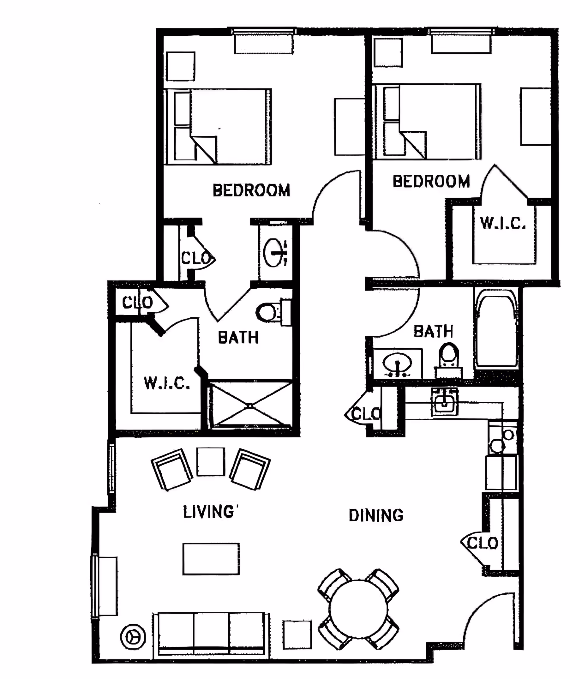 Floor plan of a two-bedroom apartment featuring two bedrooms, two bathrooms, a living area with seating, a dining area with a round table and four chairs, a kitchen, and multiple closets including walk-in closets.