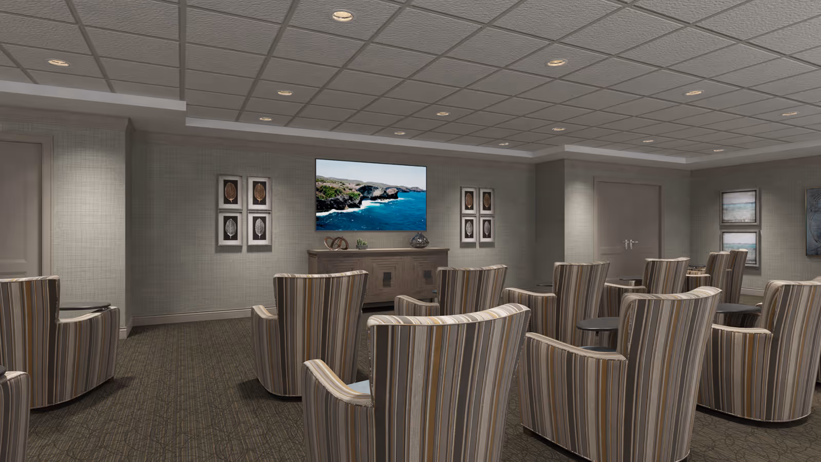 A cozy media room with rows of striped armchairs facing a wall-mounted TV and neutral decor.