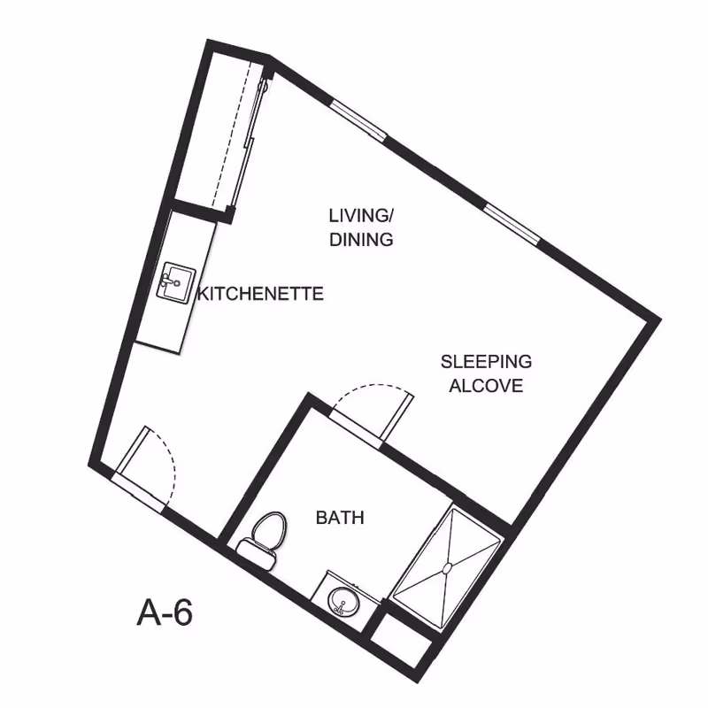 Architectural floor plan of a studio apartment layout labeled A-6, featuring a kitchenette, living/dining area, sleeping alcove, and a bathroom with a toilet, sink, and shower.