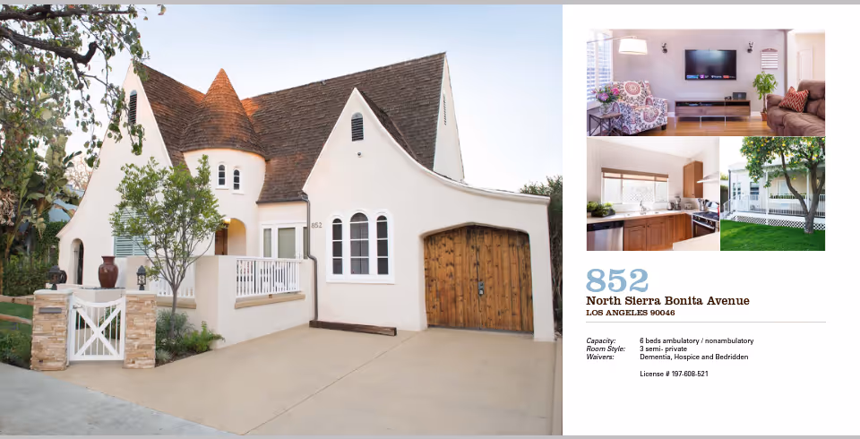 Exterior view of a cream-colored residential house with curved roof and wooden garage door.