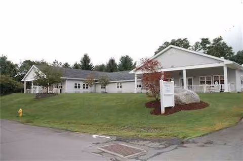 Front exterior of Forest City Nursing and Rehab Center, a single-story building with a manicured lawn.