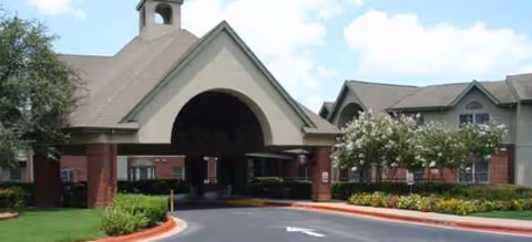 Brookdale Westlake Hills exterior entrance with a covered porte-cochere and landscaped area.