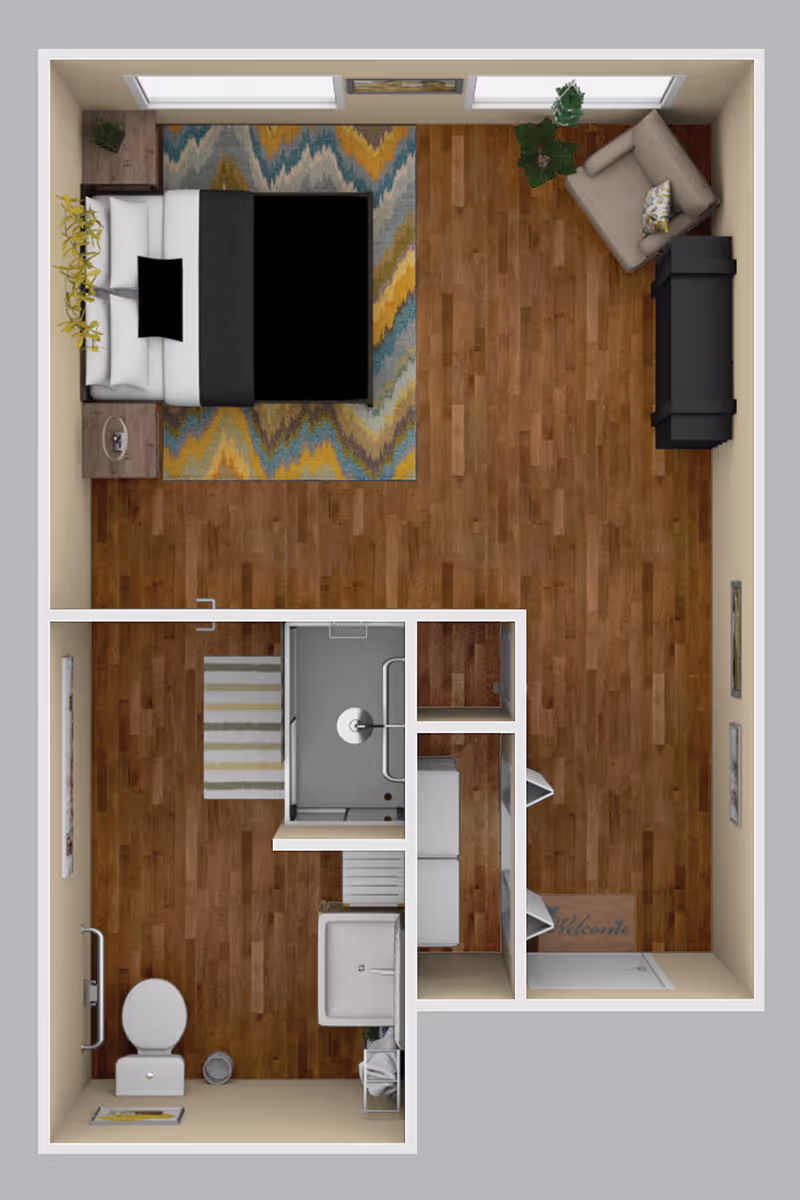 Top-down floor plan of a studio apartment showing a bed, seating area with sofa and chair, hardwood floors, entryway with closets, and a bathroom.