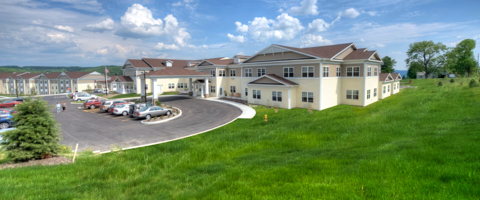 Exterior view of Good Shepherd Village at Endwell campus with green lawn and parking.