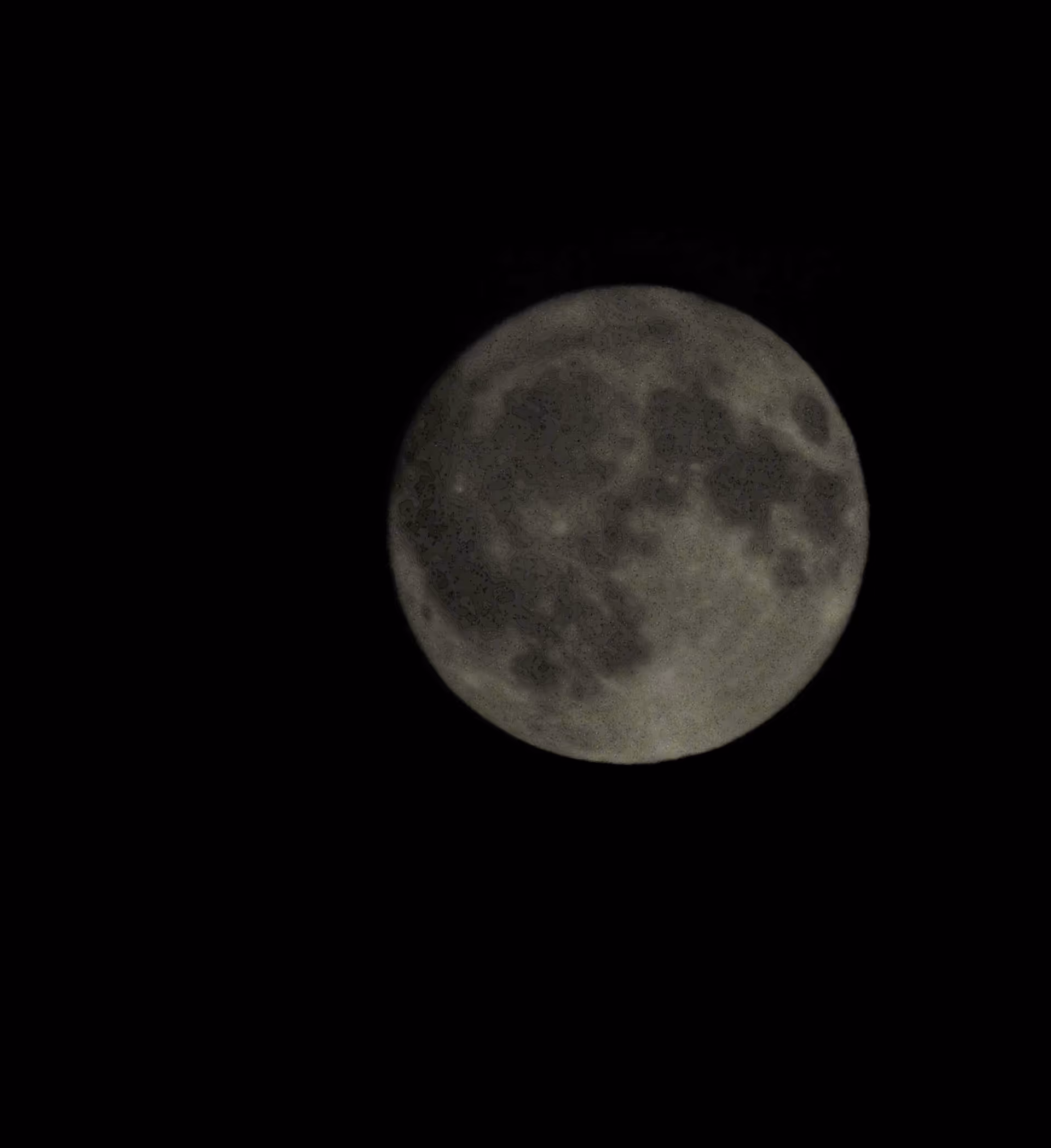 Close-up of the full moon against a black night sky.