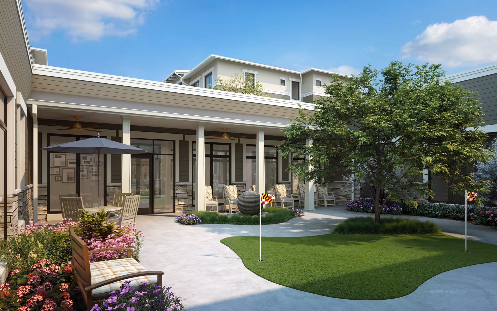 Outdoor courtyard area of a senior living facility with a putting green, a large tree, patio seating with chairs and tables under an umbrella, and a covered porch with additional chairs. The building exterior features large windows and stone accents under a clear blue sky.
