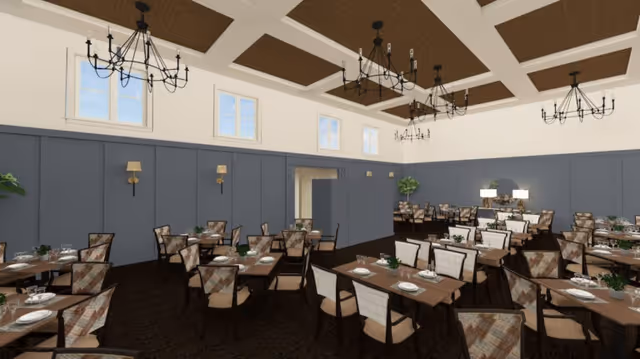 Large dining room with rows of set tables and chairs under a coffered ceiling with chandeliers.