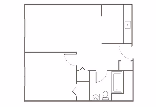 Floor plan diagram of an apartment showing rooms, a bathroom with sink, toilet and bathtub, closets, and a kitchen area.