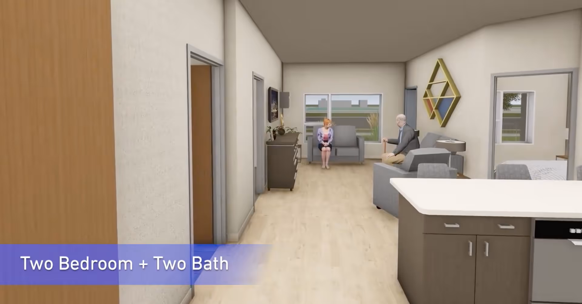 Interior view of a senior living facility showing a hallway leading to a living area with two elderly people sitting and talking. The space includes a kitchen counter in the foreground, a decorative wall piece, and a bedroom visible through an open door.