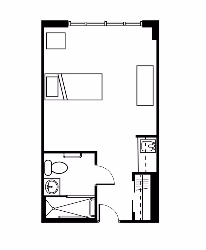 Architectural floor plan of a small studio apartment featuring a bed, a small table, a kitchenette with a sink, and a bathroom with a toilet, sink, and shower.