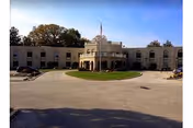Exterior view of Bryn Mawr Extended Care Center with circular driveway and entrance.
