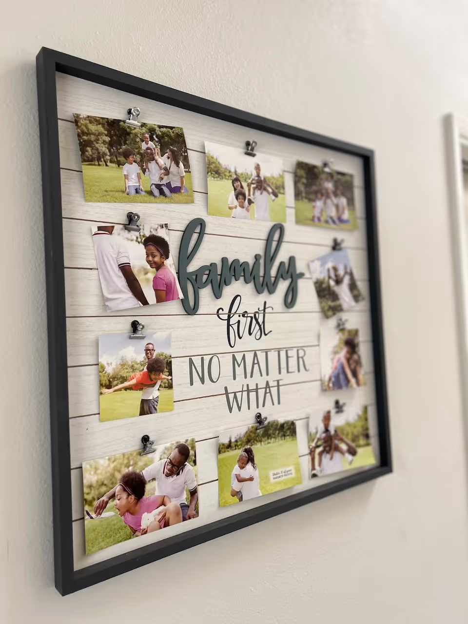 A framed collage on a wall featuring multiple photos of a family enjoying outdoor activities together, with the words 'family first NO MATTER WHAT' in the center.