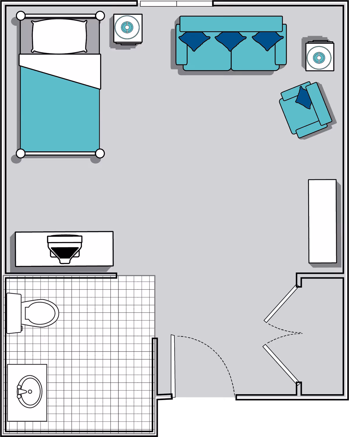 Floor plan of a studio apartment featuring a bed with a nightstand, a sofa with three cushions, an armchair with a cushion, a TV stand, and a bathroom with a toilet and sink.