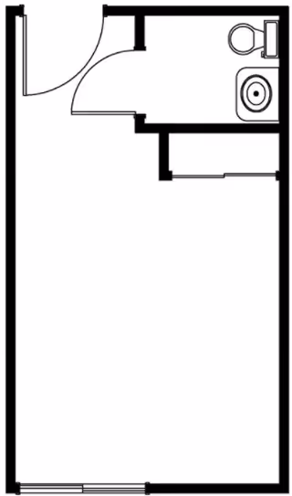 Black and white architectural floor plan of a small room with an attached bathroom. The bathroom includes a toilet and a sink. The main room has a door on the top left and a window on the bottom side.