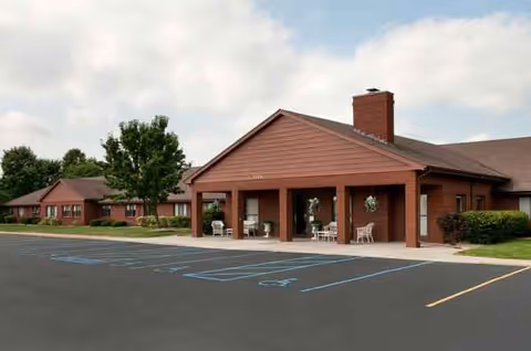 Front exterior of Life Care Center of Valparaiso with porch seating.