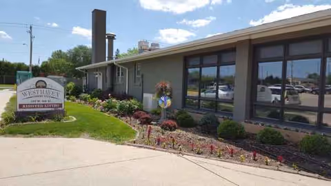 Exterior view of Westhaven Community with landscaped entrance and large windowed facade.