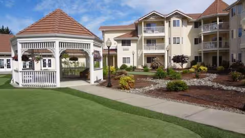 Exterior view of Countryside Village senior living with gazebo, walkway, and landscaped courtyard.