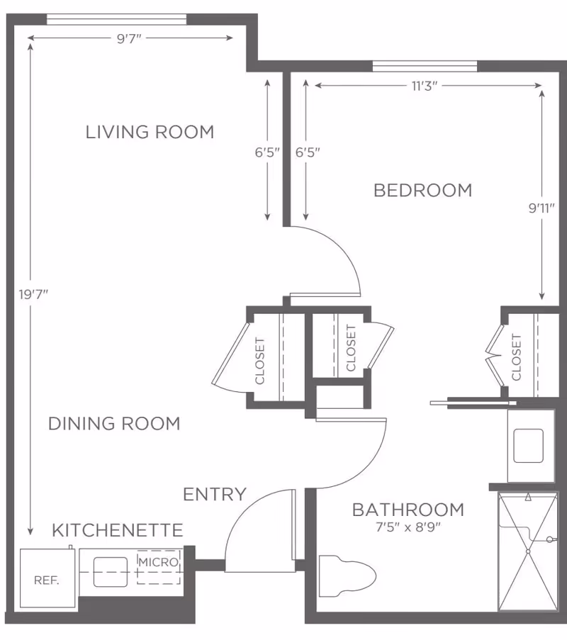 Floor plan of a senior living unit at Emerald Court showing a living room, dining room, kitchenette with refrigerator and microwave, entry, bedroom with closets, and bathroom with shower and toilet. Dimensions of rooms and closets are indicated.