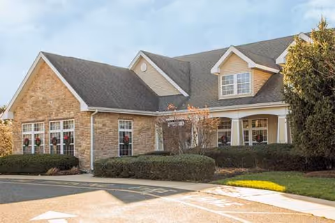 Exterior view of Brookdale Florence senior living facility with brick facade and landscaping.