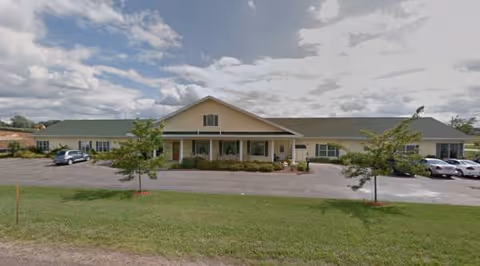 Fair Haven single-story facility with a front entrance, parking lot, and landscaped surroundings.