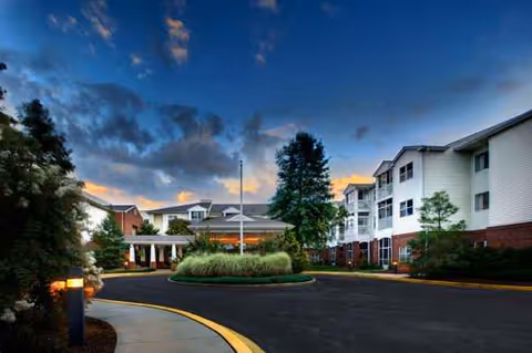 Exterior view of Heron Point of Chestertown with circular driveway and landscaped entrance.