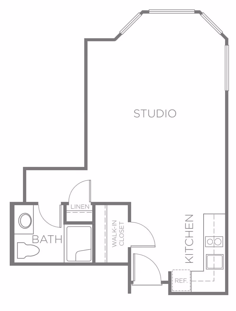Floor plan of a studio apartment at Heritage Greens showing a combined studio living space, a kitchen area with refrigerator and sink, a walk-in closet, a linen closet, and a bathroom with toilet and bathtub.