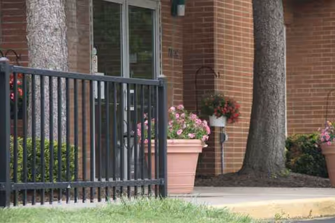 Entrance of Eden Rehabilitation and Nursing Center with railing and flower pots.