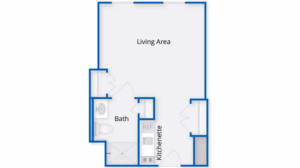 Floor plan layout showing a living area, kitchenette, and bathroom with a shower, toilet, and sink.
